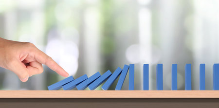 The Domino effect stopped by unique, Business Ideasの写真素材