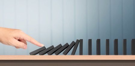 The Domino effect stopped by unique, Business Ideasの写真素材