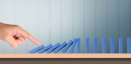 The Domino effect stopped by unique, Business Ideasの写真素材