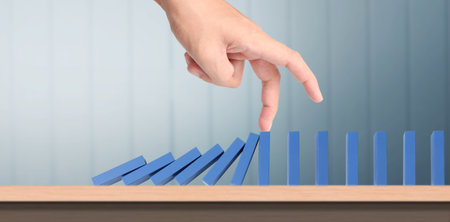 The Domino effect stopped by unique, Business Ideasの写真素材