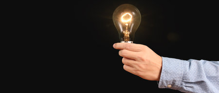 Humans hold light bulbs in hand innovative technology and creativityの写真素材