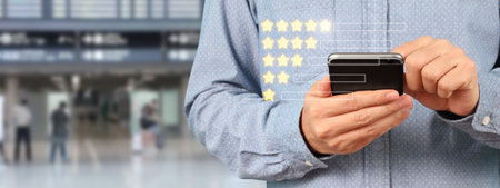 Man holding smartphone device and touching screen with five star rating feedback icon