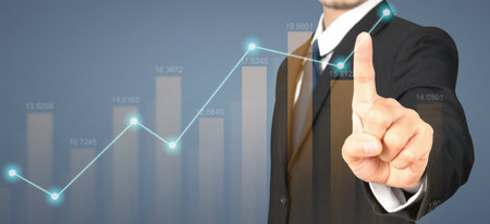 Businessman plan graph growth and increase of chart positive indicatorsの写真素材