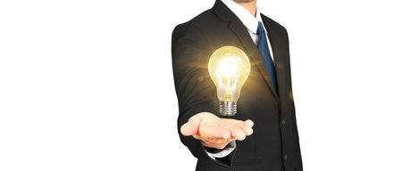 Humans hold light bulbs in hand innovative technology and creativityの写真素材