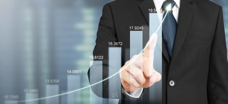 Businessman plan graph growth and increase of chart positive indicatorsの写真素材