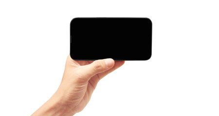Hand holding smartphone device and touching screen in handの写真素材