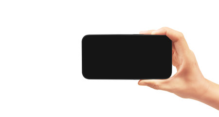Hand holding smartphone device and touching screen in handの写真素材