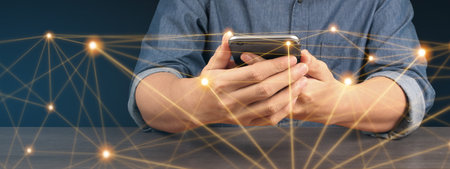 Hand holding smartphone device and touching screen. Stock exchange market concep