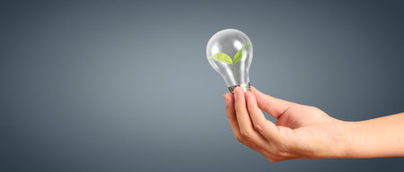 Humans hold light bulbs in hand innovative technology and creativityの写真素材