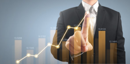 Businessman plan graph growth and increase of chart positive indicators in his businessの写真素材