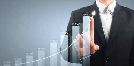 Businessman plan graph growth and increase of chart positive indicators in his businessの写真素材