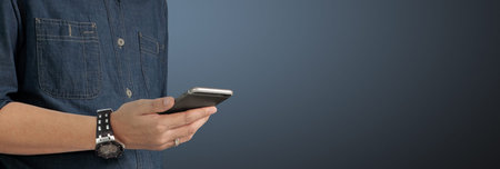 Man holding smartphone device touching screen