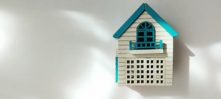 Charming decorative birdhouse indoor space home decor bright environment close-up view whimsical conceptの写真素材