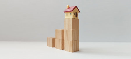 Creative building blocks arrangement with house model minimalist setting wooden materials modern aestheticの写真素材