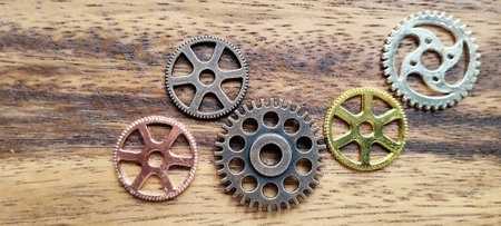 Exploring intricate metal gears workshop setting close-up photography industrial environment artistic perspective mechanical designの写真素材