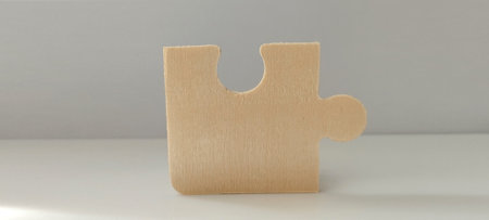 Puzzle piece focus minimalist studio product photography neutral background close-up problem solving conceptの写真素材