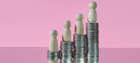 Financial growth progression with stacked coins and figures studio infographic minimalist creative conceptの写真素材