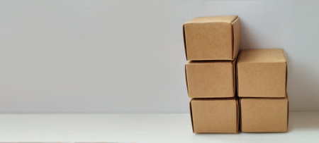 Organizing cardboard boxes warehouse product photography minimalist setup top view storage solutionsの写真素材