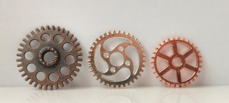Mechanical gears arrangement industrial setting close-up photography textured background artistic perspective engineering conceptの写真素材