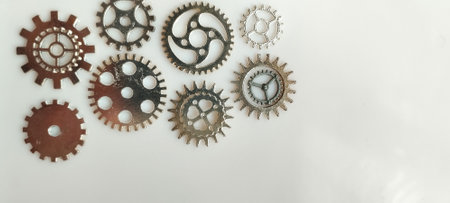 Industrial gear mechanism close-up workshop setting metal components steampunk vibe high detail mechanical artistryの写真素材