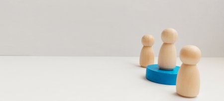 Team collaboration in a minimalist workspace people wood figures office close-up conceptual developmentの写真素材