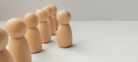Social interaction concept with wooden figures minimalist studio setting conceptual photographyの写真素材