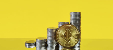 Investing in cryptocurrency ethereum coins stacked on yellow background financial asset modern...