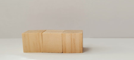 Creative block stacking event with wooden cubes indoor setting minimalist design calm environment...