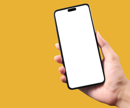 Hand holding a smartphone device and touching screenの写真素材