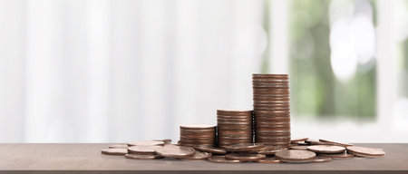 Stack of coin with trading graph, financial investment concept
