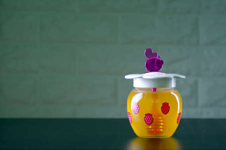 jar with honey front viewの写真素材