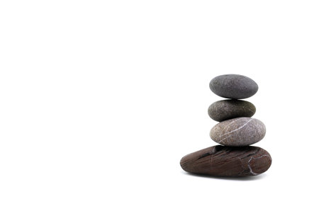 Tower of sea stones on a white isolated background close-up