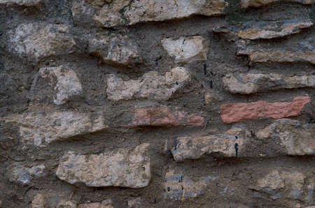 old stone wall outdoors for background, texture.Natural stone masonryの写真素材
