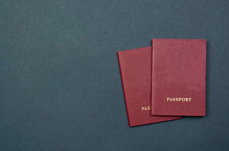 Two passports with on a black background for customs top view. place for textの写真素材