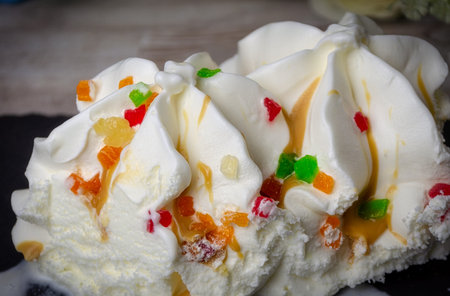Ice cream ice cream sprinkled with colored pieces of fruit, quench thirst, cool. close up