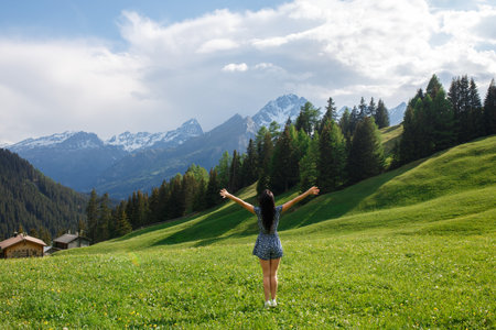 Beautiful young tourist girl with backpack in natureの写真素材