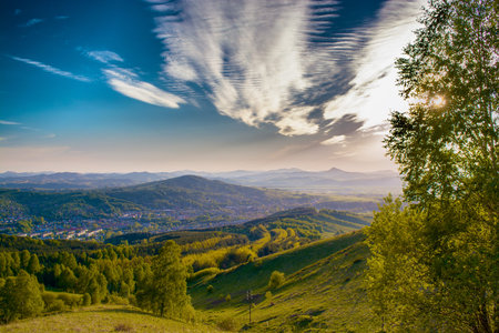 Mountain landscape with the sun.