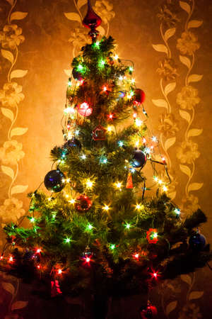 Christmas tree with colorful garlandsの写真素材