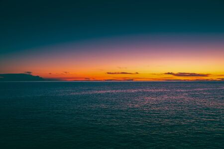 Washed Colorful Sunset Over the Seaの写真素材