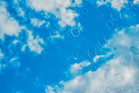 Thousands of Bubbles Against Bright Blue Skyの写真素材