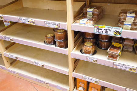 New York, USA - April 2, 2020: Empty shelves with groceries in supermarkets because of the panic from the coronavirus.のeditorial素材