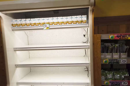 New York, USA - April 2, 2020: Empty shelves with groceries in supermarkets because of the panic from the coronavirus.のeditorial素材