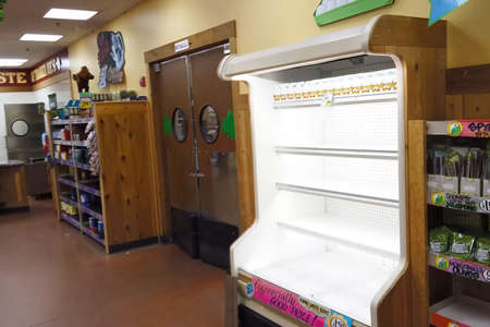 New York, USA - April 2, 2020: Empty shelves with groceries in supermarkets because of the panic from the coronavirus.のeditorial素材