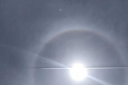 The phenomenon of halo in the sky. A rare natural phenomenon. Three halo suns.