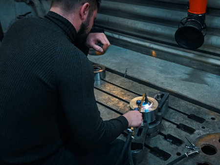 The worker violated safety and welding rules without a protective mask. The welder cooks the item by...