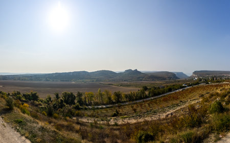 Mountains and forests of Crimea. coniferous and deciduous trees on the hills of the mountains and rocksの写真素材