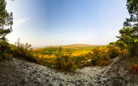 Mountains and forests of Crimea. coniferous and deciduous trees on the hills of the mountains and rocksの写真素材