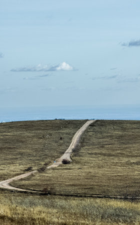 A dirt road to the sea on the hill. Crimea.の写真素材