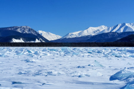 The shore of Lake Baikal in winter. Snow and ice on the baikal.の写真素材