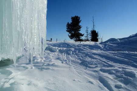 Long icicles hang from the rockの写真素材